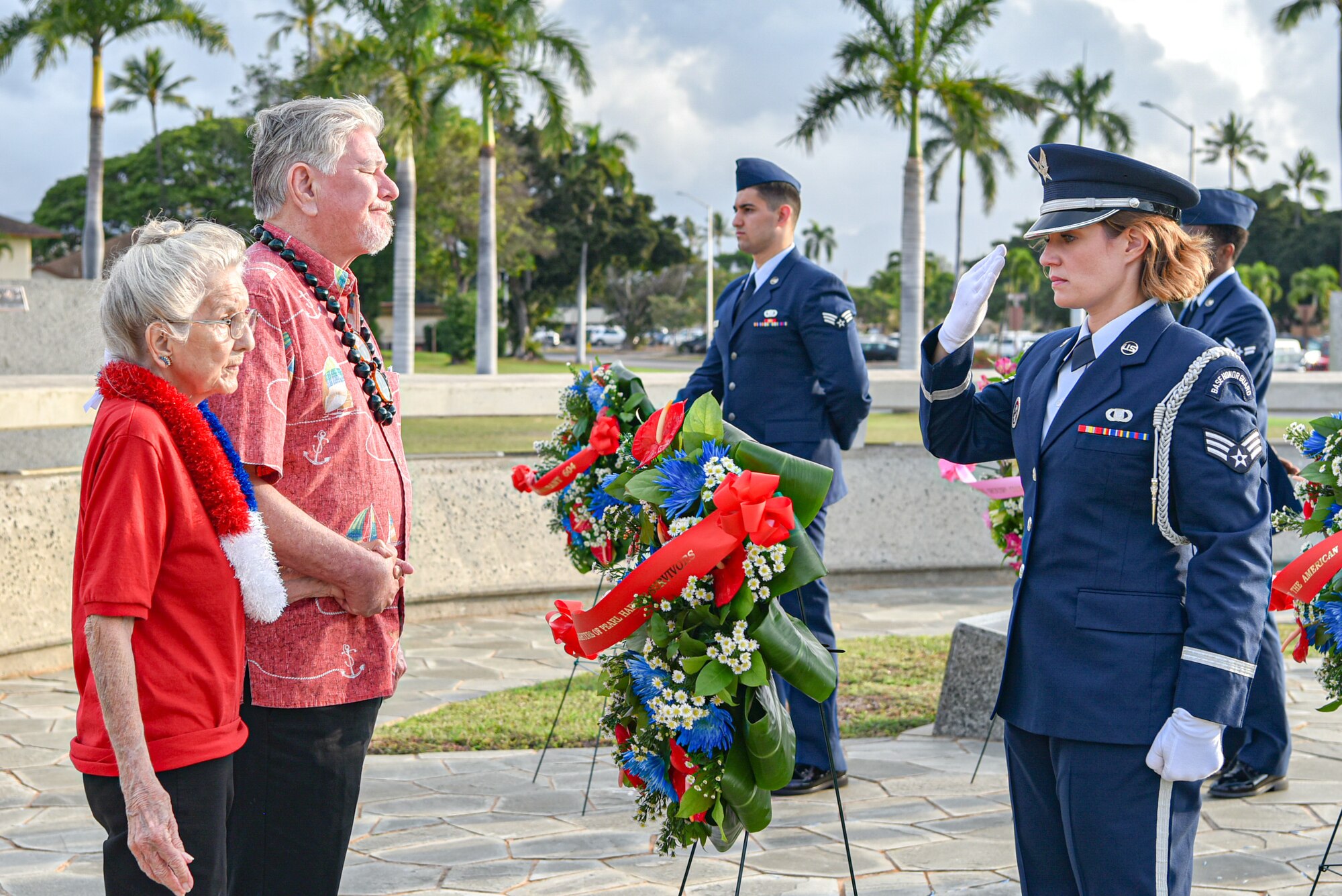 Friends and family of late Hickam Field veteran survivors present a wreath at the Attack on Hickam Field Remembrance Ceremony at Joint Base Pearl Harbor-Hickam, Hawaii, Dec. 7, 2022. The 15th Wing continues to honor those who survived the historic attacks,  those who paid the ultimate sacrifice and their families while reminding those who currently serve of the legacy of those who came before. (U.S. Air Force Photo by Tech. Sgt. Anthony Nelson Jr.)