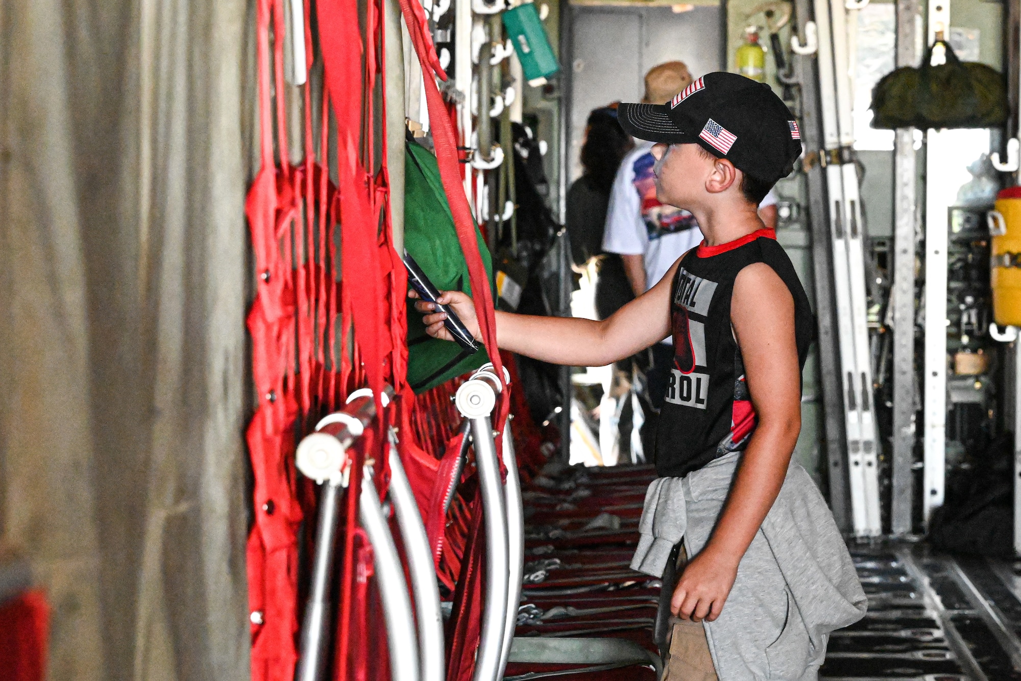 A child explores inside of a C-130J.