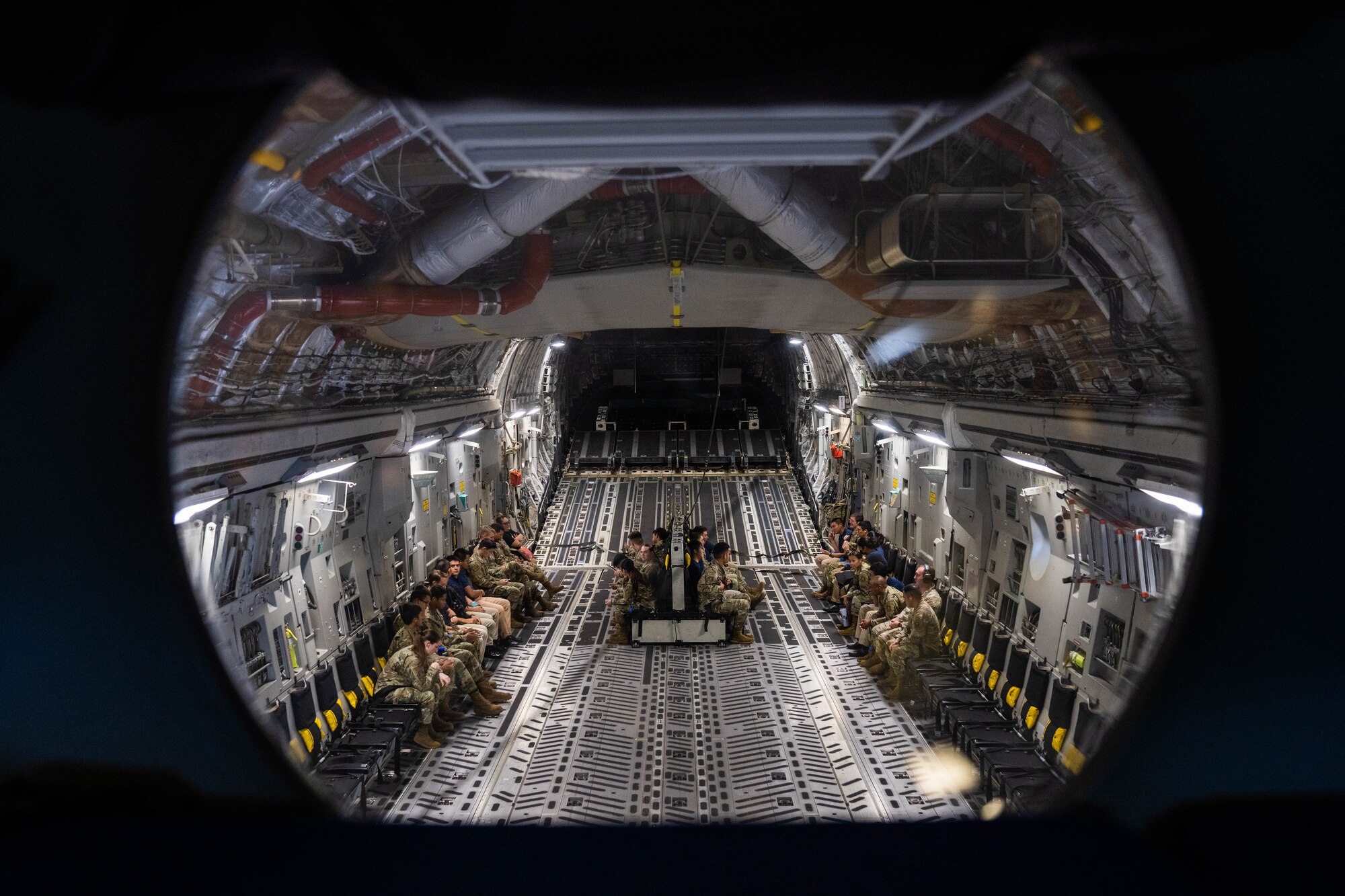 U.S. Air Force ROTC cadets from the University of Hawaii Manoa participate in an orientation flight on a C-17 Globemaster III around the Hawaiian Islands, Dec. 5, 2022. The Cadets were given the opportunity to get an in-depth experience and learned the premier airlift capabilities of the 15th Wing Mission. (U.S. Air Force photo by Senior Airman Makensie Cooper)
