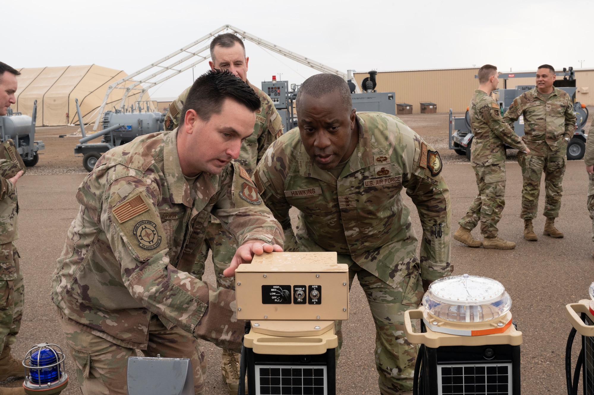 U.S. Air Force Tech. Sgt. Tyler Erwin, 635th Materiel Maintenance Squadron electrical systems supervisor, showcases an emergency airfield lighting system to U.S. Air Force Lt. Gen. Stacey Hawkins, Air Force Sustainment Center commander, during an immersion tour with the 635th MMG at Holloman Air Force Base, New Mexico, Dec. 7, 2022.While touring the base, Hawkins was given a firsthand account of the current assets and deployment capabilities that BEAR has to offer. (U.S. Air Force photo by Airman 1st Class Isaiah Pedrazzini)