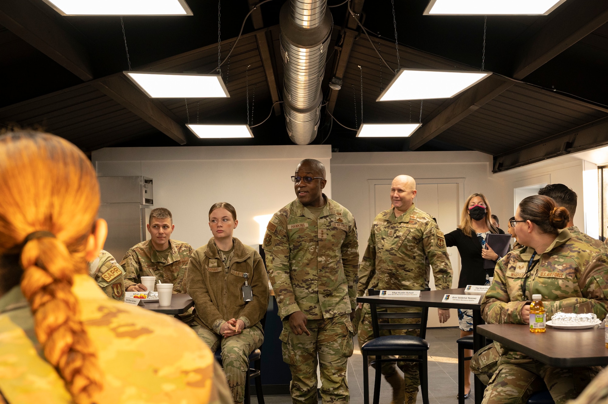 U.S. Air Force Lt. Gen. Stacey Hawkins, Air Force Sustainment Center commander, center, and U.S. Air Force Chief Master Sgt. Robert Schultz, Air Force Sustainment Center command chief, center right, arrive to greet Airmen from the 635th Materiel Maintenance Group at Holloman Air Force Base, New Mexico, Dec. 6, 2022. The 635th MMG is the Air Force’s only organic Basic Expeditionary Airfield Resources, or BEAR, unit and provides flexible and responsive resources to support the nation’s operations around the world. (U.S. Air Force photo by Airman 1st Class Isaiah Pedrazzini)