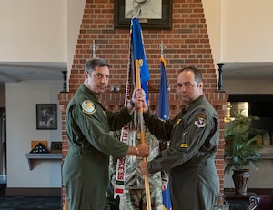 U.S. Air Force Col. Alexander Heyman, left, 14th Operations Group commander, and Lt. Col. Michael Raabe, 81st Fighter Squadron commander, prepare to case the squadron's guidon at Moody Air Force Base, Georgia, Dec. 5, 2022. The 81st was a tenant unit at Moody AFB from 2014-2022, originally activated out of Key Field, Mississippi, which loaned out to Air Combat Command’s 23rd Wing. (U.S. Air Force photo by Airman 1st Class Whitney Gillespie)