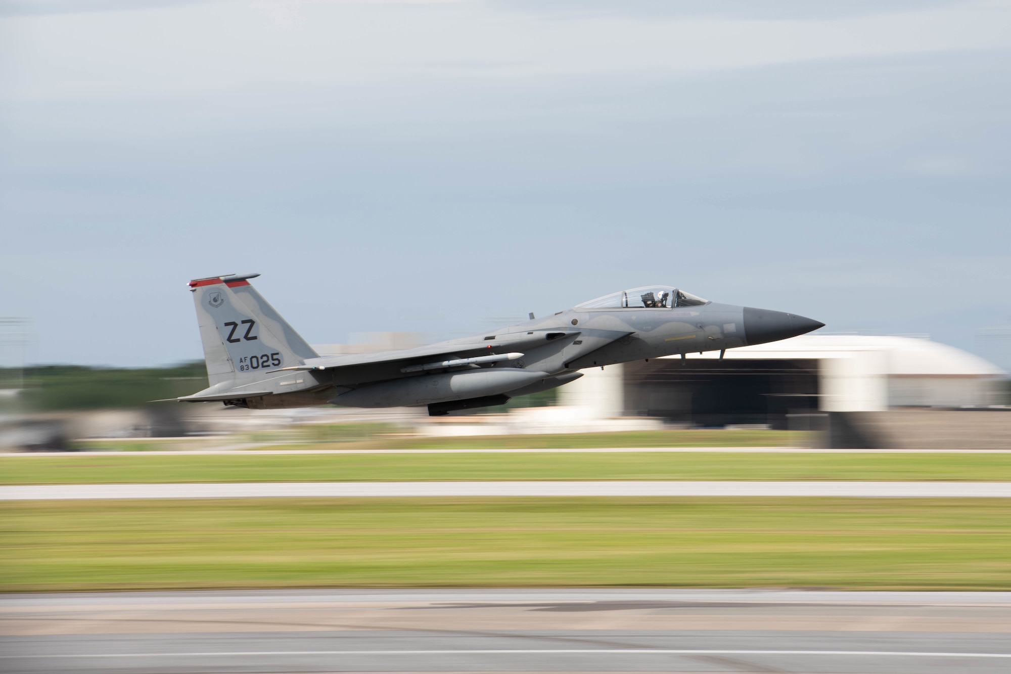 An F-15 streaks by while taking off from Kadena Air Base.