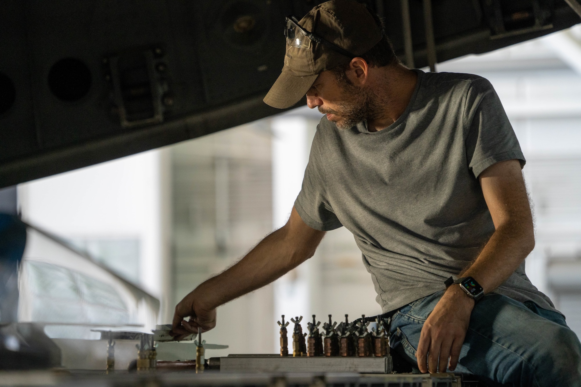 Darcy Morgan, 15th Maintenance Squadron aircraft structural maintenance craftsman repairs the ramp of a C-17 Globemaster III during a depot level repair at Joint Base Pearl Harbor-Hickam, Hawaii, Dec. 2, 2022. The ASM flight is responsible for repairing physical damage and maintaining the high quality structures on the aircraft. (U.S. Air Force photo by Senior Airman Makensie Cooper)