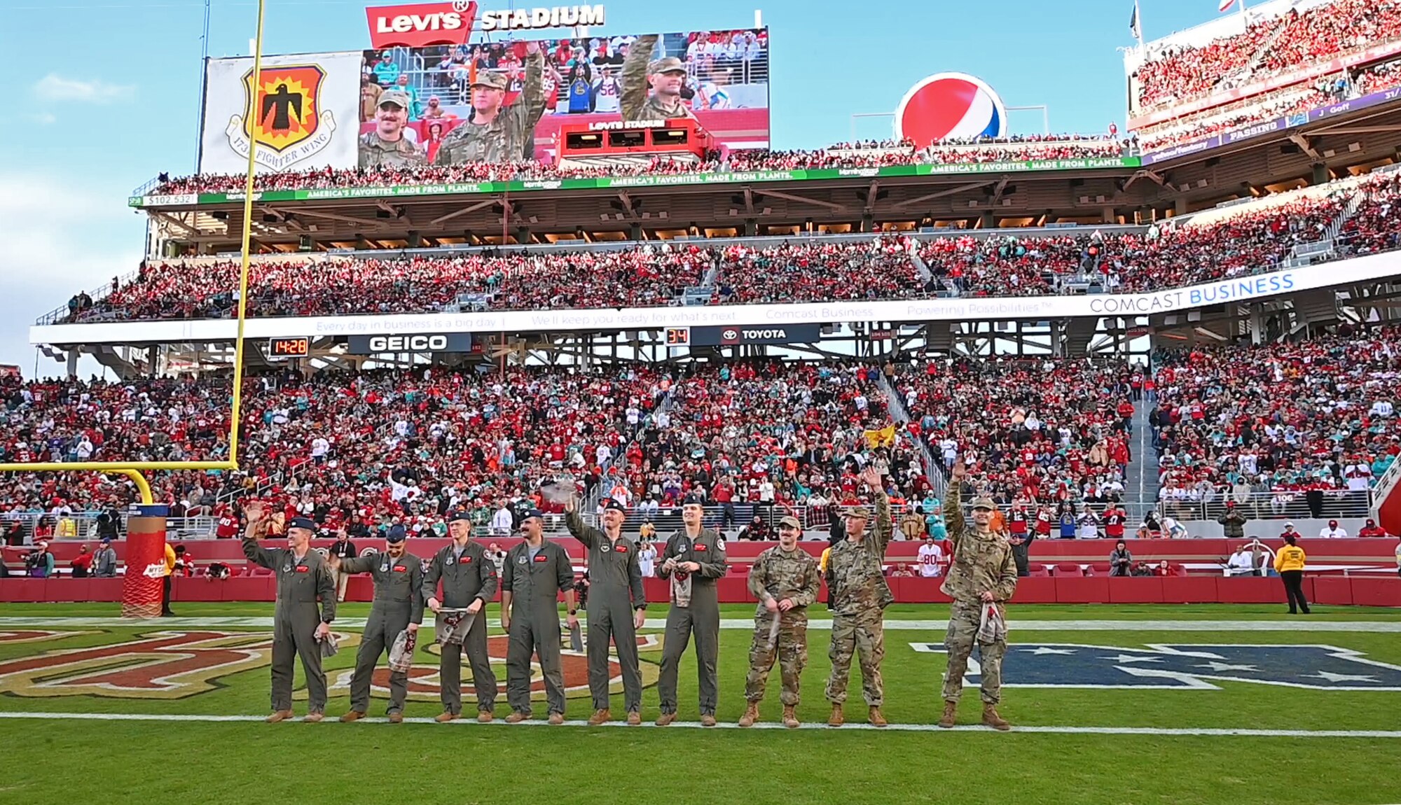 Airmen on football field