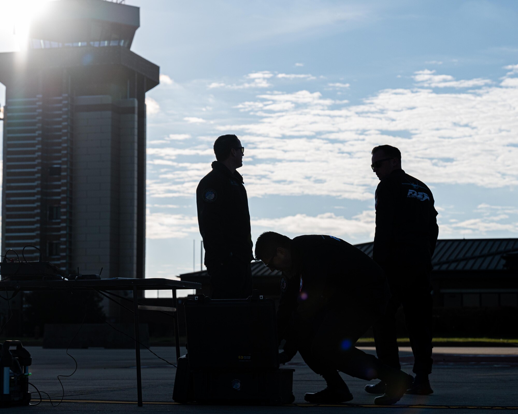 Demo team members standing on the flight line