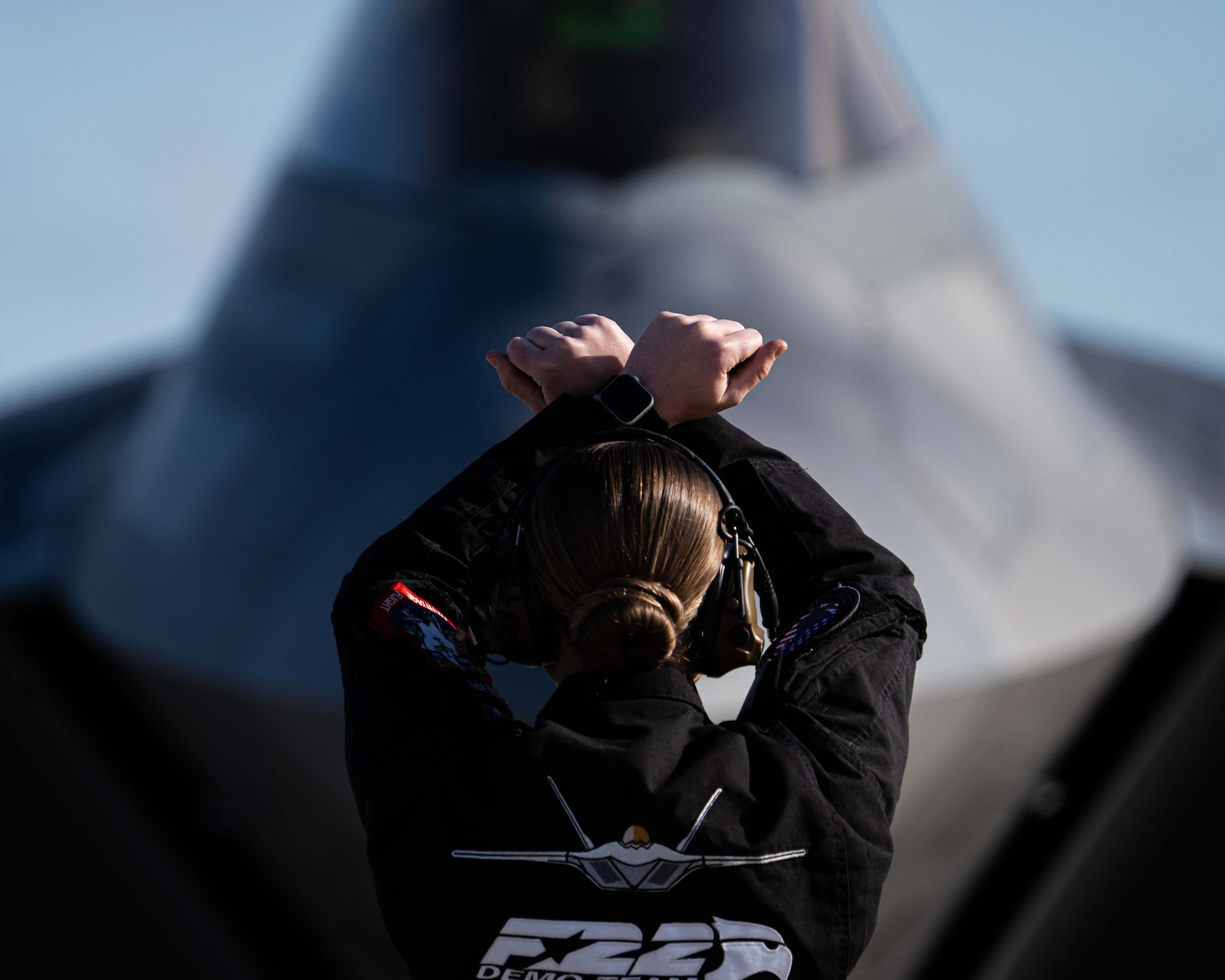 Staff Sgt. Lauren Ooghe guides Capt. Samuel “RaZZ” Larson