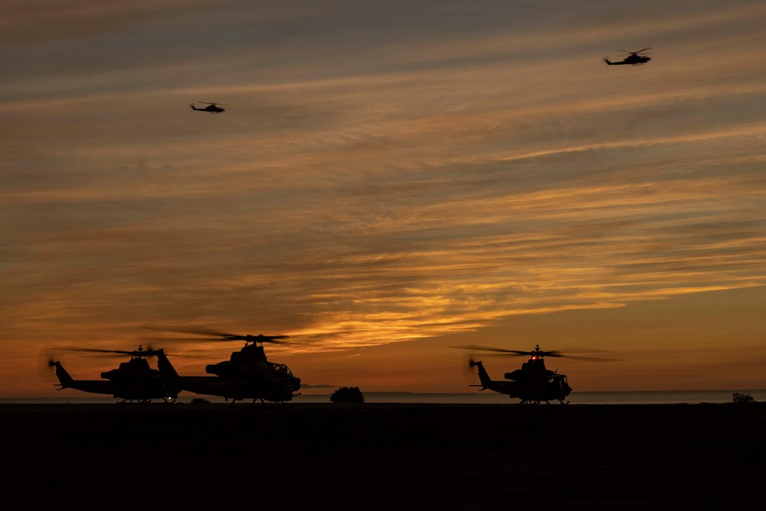 U.S. Marine Corps AH-1Z Vipers and a UH-1Y Venom with Marine Light Attack Helicopter Squadron 169, Marine Aircraft Group 39, 3rd Marine Aircraft Wing (MAW), prepare to take off from a forward arming and refueling point during exercise Steel Knight 23 on Red Beach, Camp Pendleton, California, Dec. 3, 2022. Exercise Steel Knight 23 provides 3rd MAW an opportunity to refine Wing-level warfighting in support of I Marine Expeditionary Force and fleet maneuver. (U.S. Marine Corps photo by Sgt. Woodward)