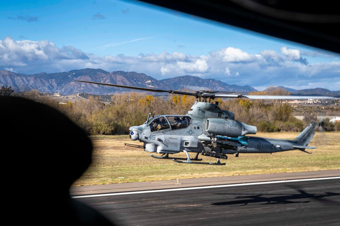 A U.S. Marine Corps AH-1Z Viper with Marine Light Attack Helicopter Squadron 369, Marine Aircraft Group 39, 3rd Marine Aircraft Wing, takes off for a flight to the USS Tripoli (LHA 7) during exercise Steel Knight 23, on Marine Corps Air Station Camp Pendleton, California, Dec. 5, 2022. Exercise Steel Knight provides 3rd MAW an opportunity to refine Wing-level warfighting in support of I Marine Expeditionary Force and fleet maneuver. (U.S. Marine Corps photo by Sgt. Fletcher)
