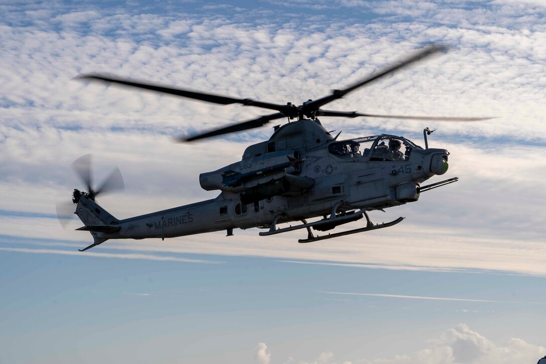 A U.S. Marine Corps AH-1Z Viper with Marine Light Attack Helicopter Squadron 369, Marine Aircraft Group 39, 3rd Marine Aircraft Wing, prepares to land aboard amphibious assault ship USS Tripoli (LHA 7) during exercise Steel Knight 23, Dec. 5, 2022. Exercise Steel Knight provides 3rd MAW an opportunity to refine Wing-level warfighting in support of I Marine Expeditionary Force and fleet maneuver. (U.S. Marine Corps photo by Sgt. Fletcher)