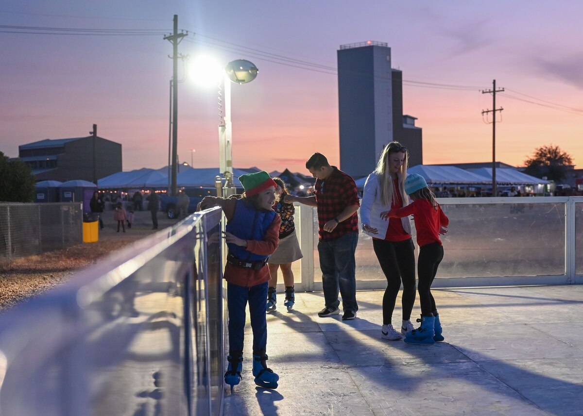 A photo of families skating on artificial ice.