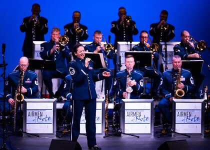 U.S. Air Force Senior Master Sgt. Emily Wellington, alto vocalist for The United States Air Force Band, sings at an Airmen of Note performance at Moon Valley High School in Phoenix, Arizona, Nov. 13, 2022. The music performed by The Airmen of Note reflects the excellence displayed by all Airmen stationed worldwide, whose selfless service and sacrifices ensure the freedoms enjoyed by citizens of the United States. (U.S. Air Force photo by Airman Bill Guilliam)