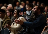 A local family applauds a performance by The United States Air Force Band’s Airmen of Note, in Yuma, Arizona, Nov. 14, 2022. The Airmen of Note played a variety of contemporary jazz pieces throughout each performance of the tour, including multiple pieces from the inspiration of the band, Maj. Glenn Miller. (U.S. Air Force photo by Airman Bill Guilliam)