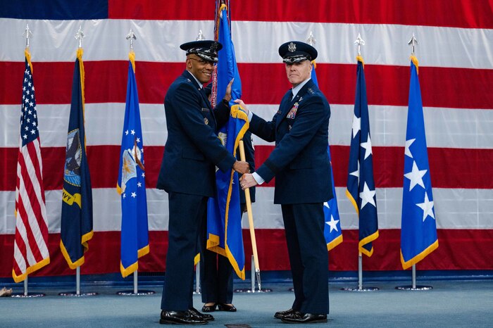 Gen. Thomas Bussiere, Air Force Global Strike Command commander, receives the guidon from Air Force Chief of Staff Gen. CQ Brown, Jr. during the AFGSC assumption of command