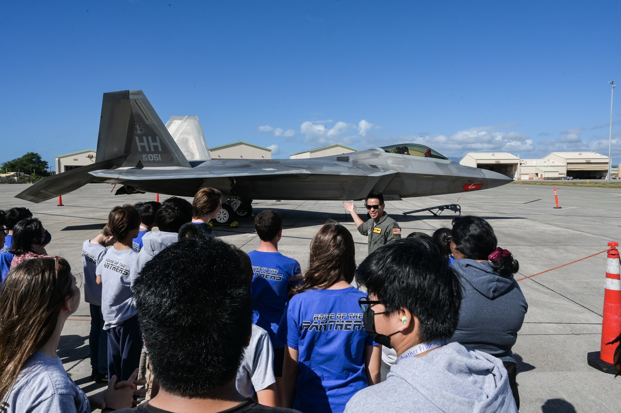 Capt. Matthew Ito, Hawaii Air National Guard 199th Fighter Squadron F-22 Raptor pilot, speaks about the F-22’s capabilities to students from Aliamanu Middle School during a base tour at Joint Base Pearl Harbor-Hickam, Hawaii, Nov. 22, 2022. Ito briefed on the jet’s mission operations and capabilities. (U.S. Air Force photo by Staff Sgt. Alan Ricker)