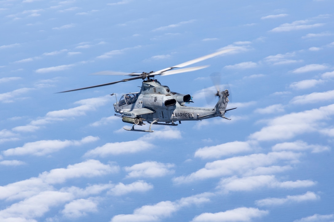 PACIFIC OCEAN (Aug. 8, 2022) – A U.S. Marine Corps AH-1Z with Marine Medium Tiltrotor Squadron (VMM) 362 (Reinforced), 13th Marine Expeditionary Unit, conducts flight operations over the Pacific Ocean, Aug. 8. The mobility and sustainability provided by amphibious platforms enable the Navy-Marine Corps team to extend the reach of our capabilities. Marines and Sailors of the 13th Marine Expeditionary Unit (MEU) and Makin Island Amphibious Ready Group (ARG) are underway conducting integrated training operations in U.S. 3rd Fleet. (U.S. Marine Corps photo by Sgt. Kevin G. Rivas)