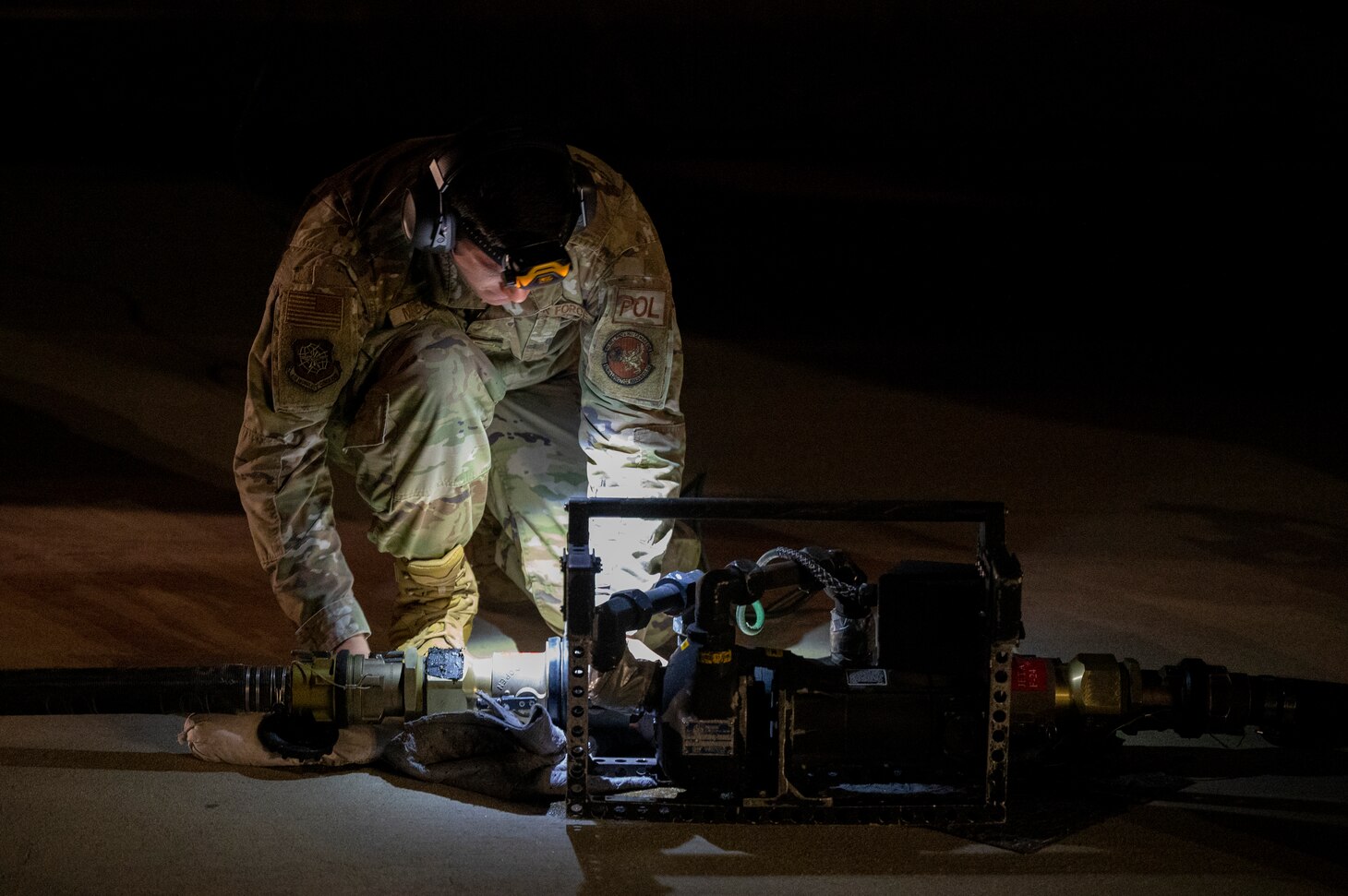 Maintenance airman with flashlight