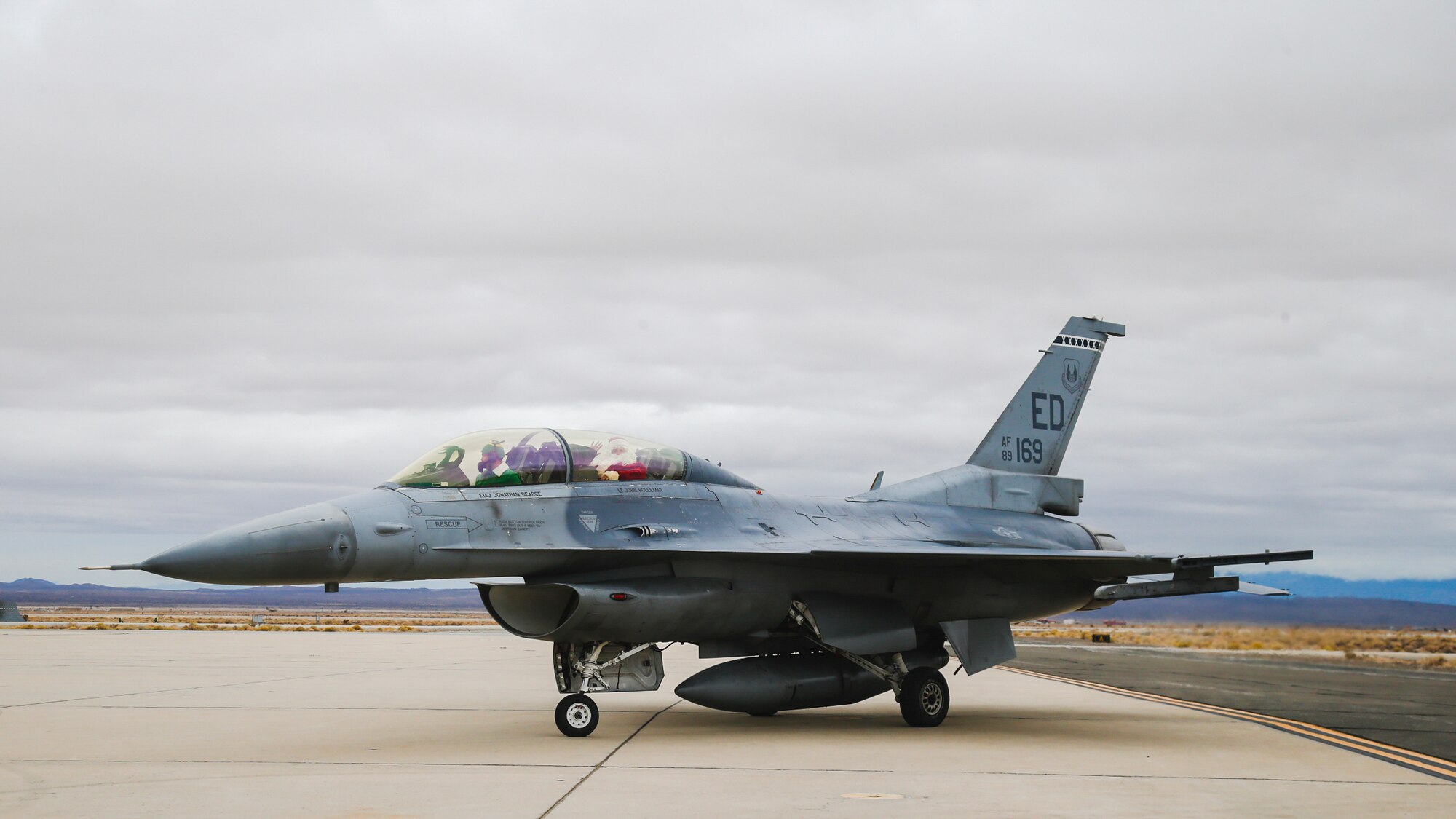 Instead of reindeer, Santa Claus comes to town... on an F-16! Santa Claus and one of his elves visited Edwards Air Force Base on an F-16 Fighting Falcon greeting base personnel and their families at a holiday party put on by the 416th Flight Test Squadron spreading holiday cheer on base... the Edwards style!