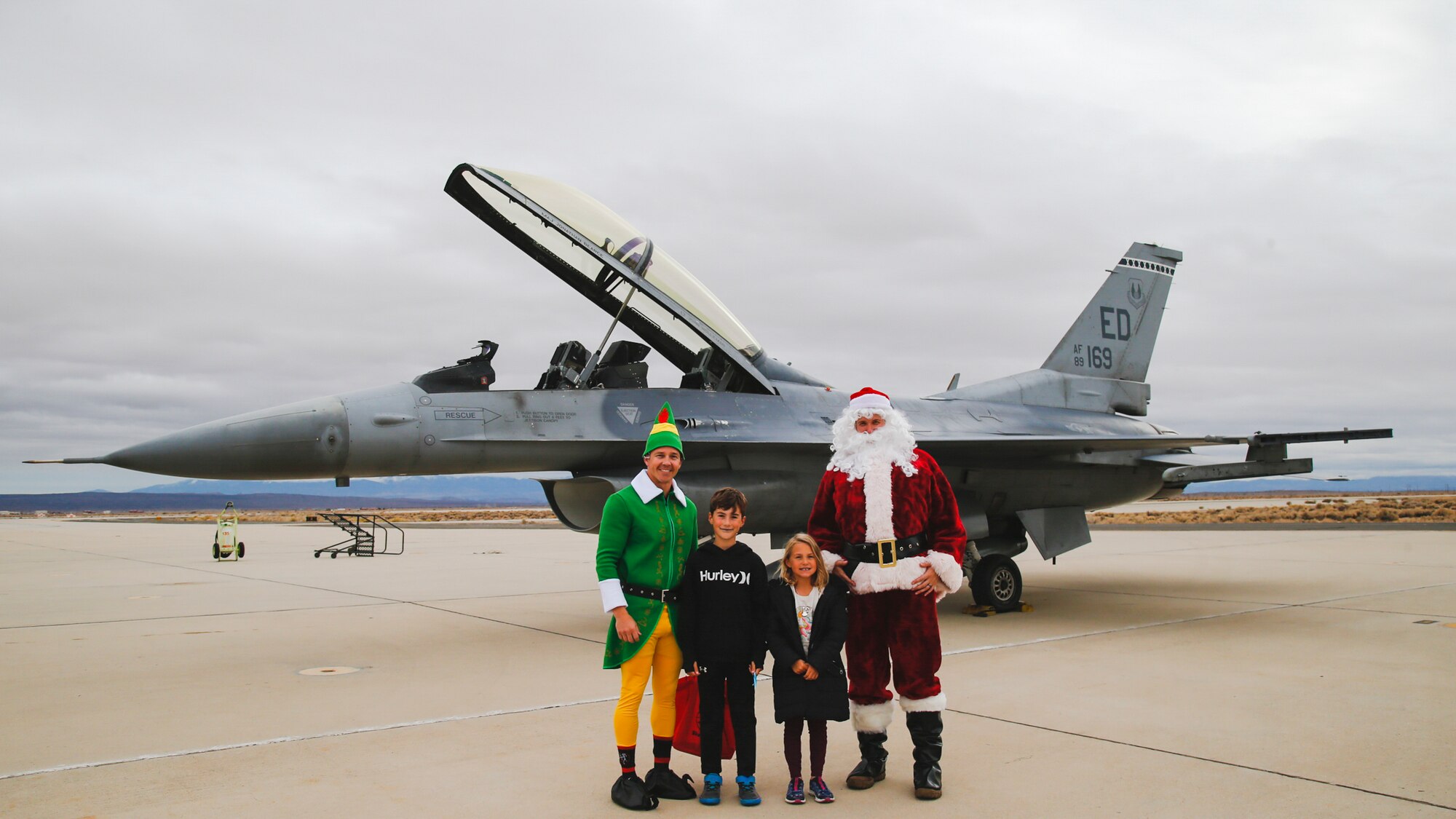 Instead of reindeer, Santa Claus comes to town... on an F-16! Santa Claus and one of his elves visited Edwards Air Force Base on an F-16 Fighting Falcon greeting base personnel and their families at a holiday party put on by the 416th Flight Test Squadron spreading holiday cheer on base... the Edwards style!