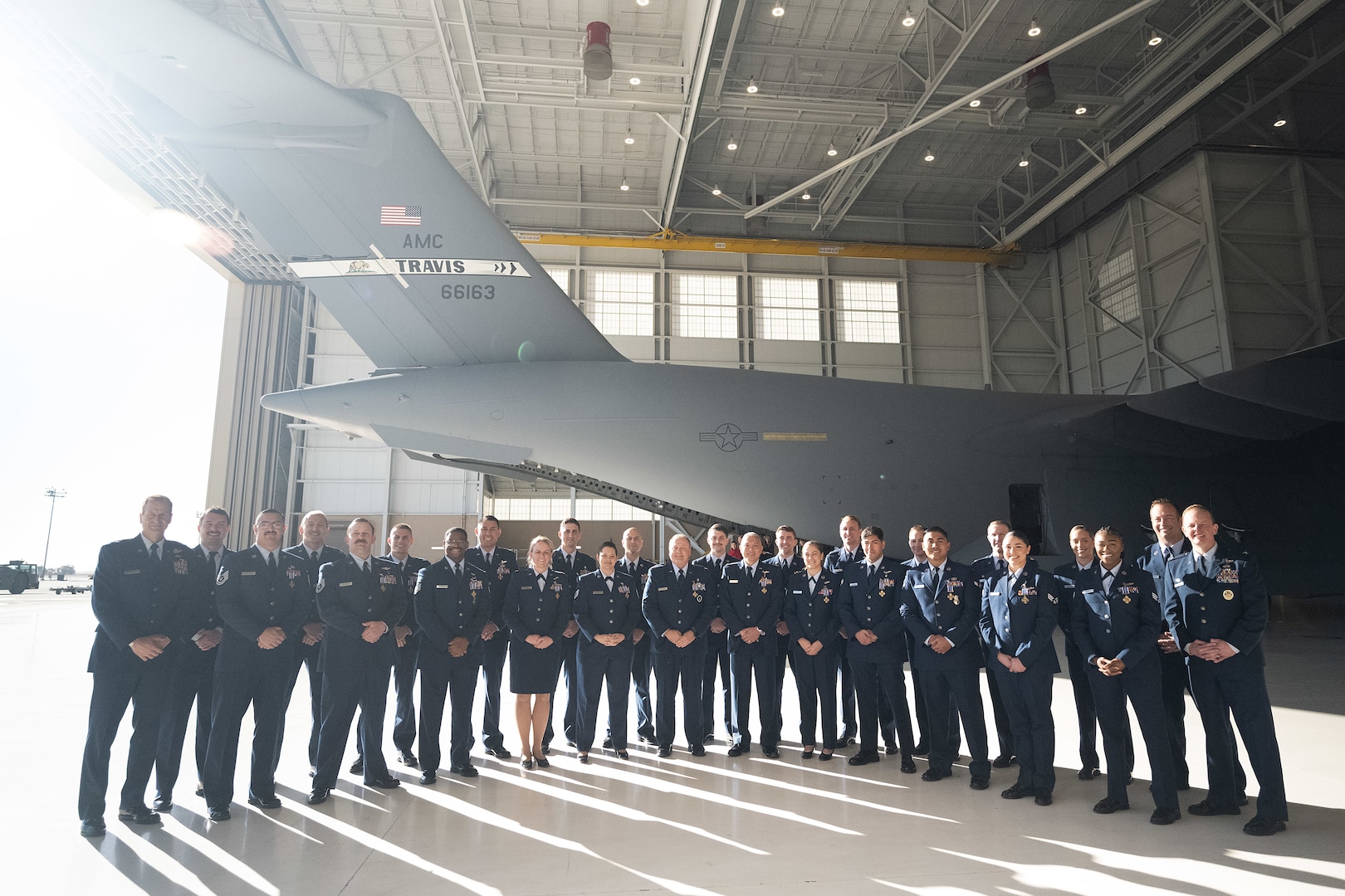 Group of military members pose together.