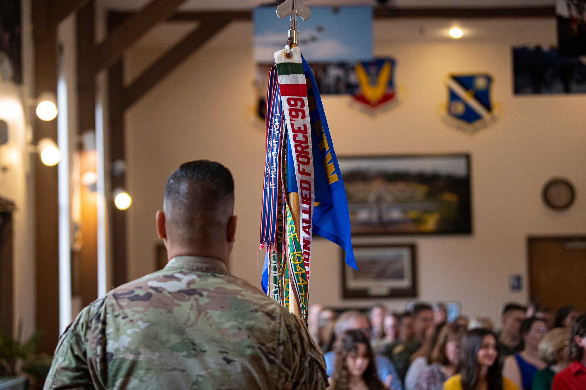 U.S. Air Force Master Sgt. Ron Olaes acts as guidon bearer for the 81st Fighter Squadron during the deactivation ceremony at Moody Air Force Base, Georgia, Dec. 5, 2022. The guidon holds a sense of pride for the unit and its commanding officer. (U.S. Air Force photo by Airman 1st Class Whitney Gillespie)