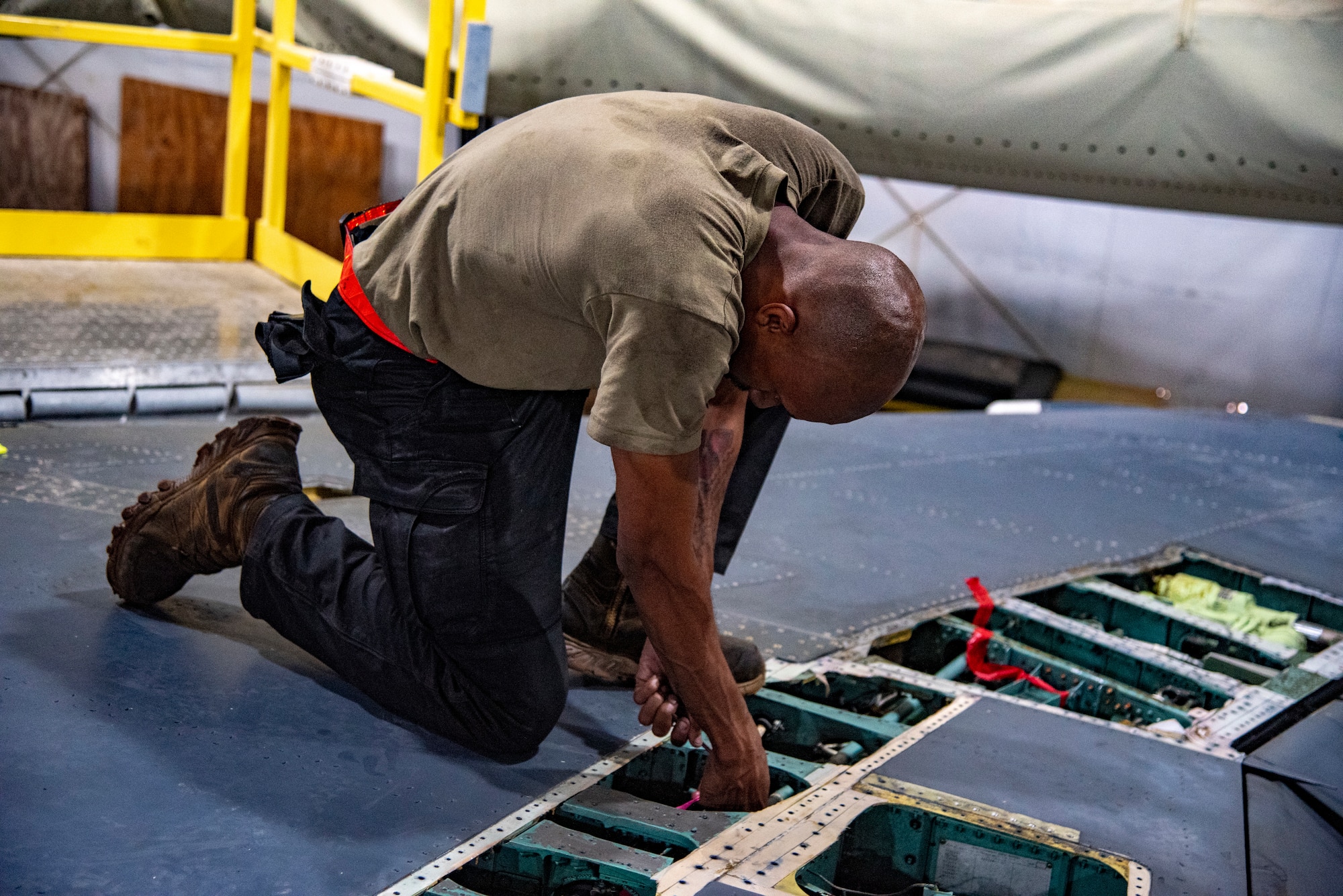 Senior Airman Wesley Tynes, 389th Expeditionary Fighter Generation Squadron, Phase Section crew chief, conducts an inspection on an F-15E Strike Eagle at an undisclosed location, Southwest Asia, Nov. 15, 2022. The Phase Section performs preventative maintenance through exhaustive inspections to detect failing components before they cause operational problems. (U.S. Air Force photo by: Tech. Sgt. Jim Bentley)