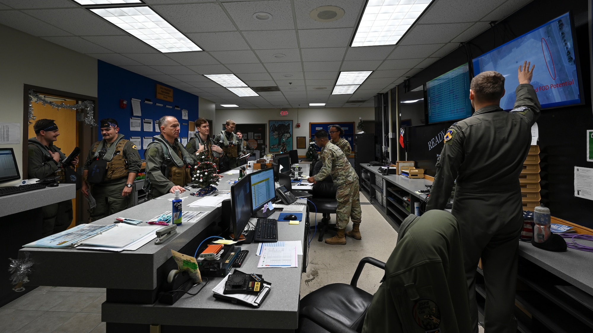 Lt. Gen. Scott L. Pleus (left), 7th Air Force commander, and other 8th Operations Group pilots receive a step brief from Capt. Brandon Pape (right), 35th Fighter Squadron Charlie flight commander, at Kunsan Air Base, Republic of Korea, Dec. 8, 2022. The purpose of step briefings is to inform pilots about the condition of the flightline area and their aircraft. (U.S. Air Force photo by Senior Airman Akeem K. Campbell)