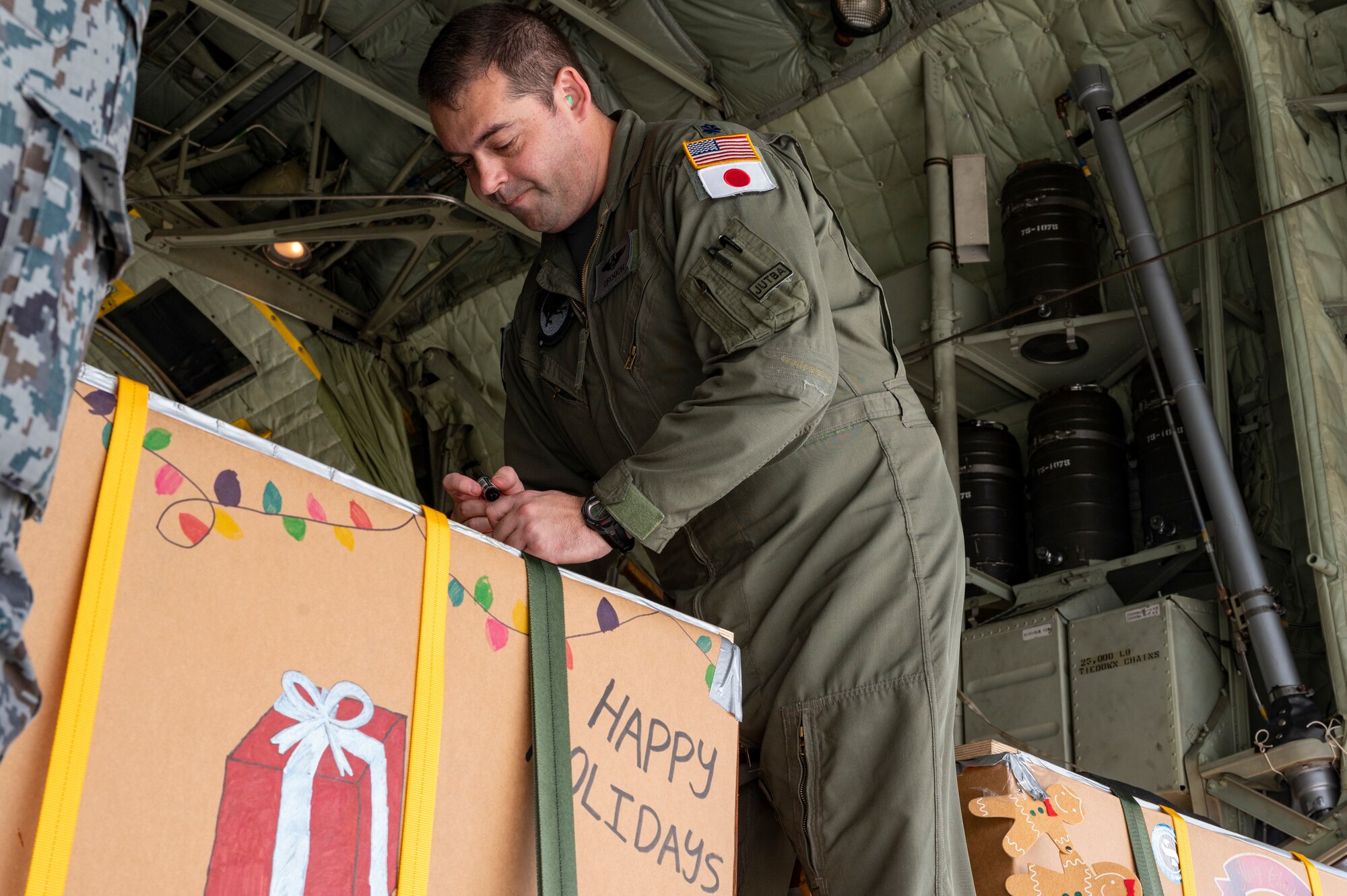 A pilot writes a message on a bundle