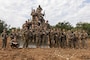 U.S. Marine Corps combat engineers with 3rd Landing Support Battalion, Combat Logistics Regiment 3, 3rd Marine Logistics Group, pose for a group photo during exercise Winter Workhorse, at Central Training Area, Camp Hansen, Okinawa, Japan, Dec. 6, 2022. Winter Workhorse is an annual exercise for CLR-3 to train to carry out mission essential tasks in forward-deployed, austere environments. (U.S. Marine Corps photo by Lance Cpl. Weston Brown)