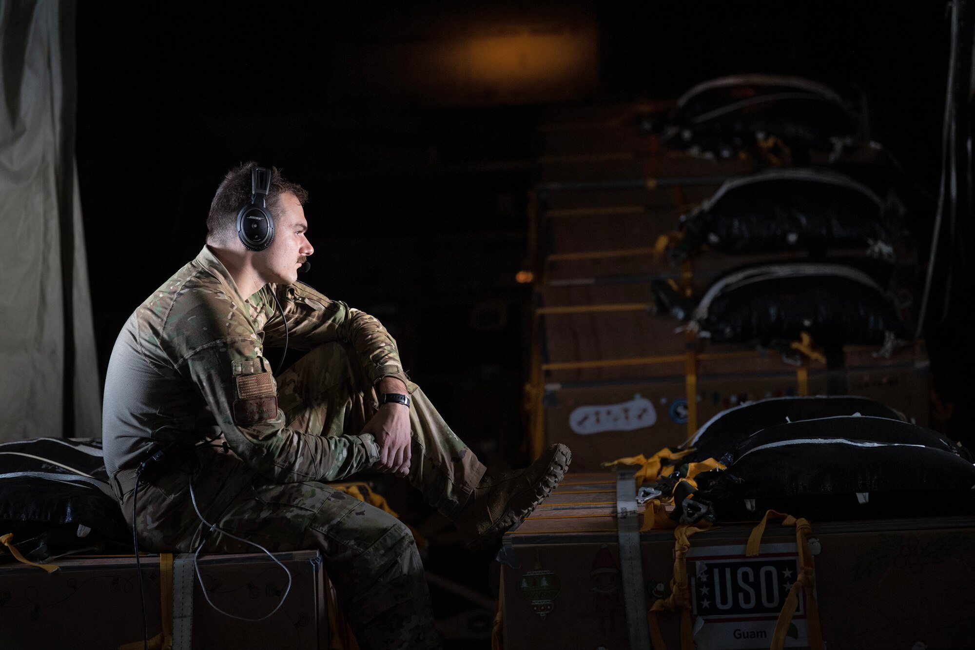 U.S. Air Force C-130J loadmaster, takes a break before conducting a low-cost, low-altitude bundle drop