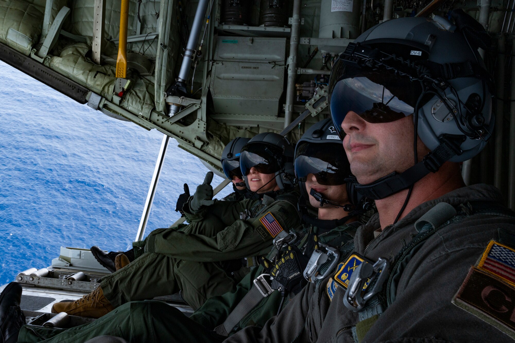 Members of the U.S. Forces Japan pose for a photo in a C-130H Hercules