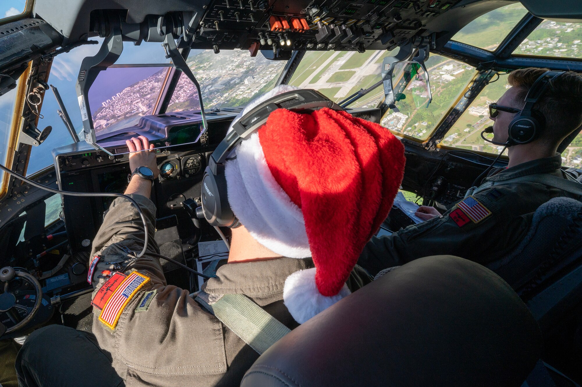 U.S. Air Force pilots fly a C-130J Super Hercules over Guam.