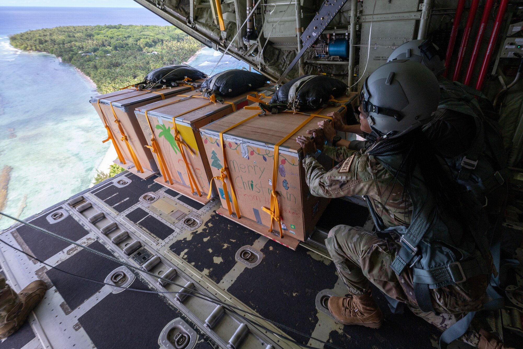 U.S. Air Force Airmen push out low-cost, low-altitude bundle drops of a C-130J Super Hercules
