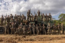 U.S. Marines with 3rd Landing Support Battalion, Combat Logistics Regiment 3, 3rd Marine Logistics Group, pose for a group photo during exercise Winter Workhorse, at Central Training Area, Camp Hansen, Okinawa, Japan, Dec. 6, 2022. Winter Workhorse is an annual exercise for CLR-3 to train to carry out mission essential tasks in forward-deployed, austere environments. (U.S. Marine Corps photo by Lance Cpl. Weston Brown)