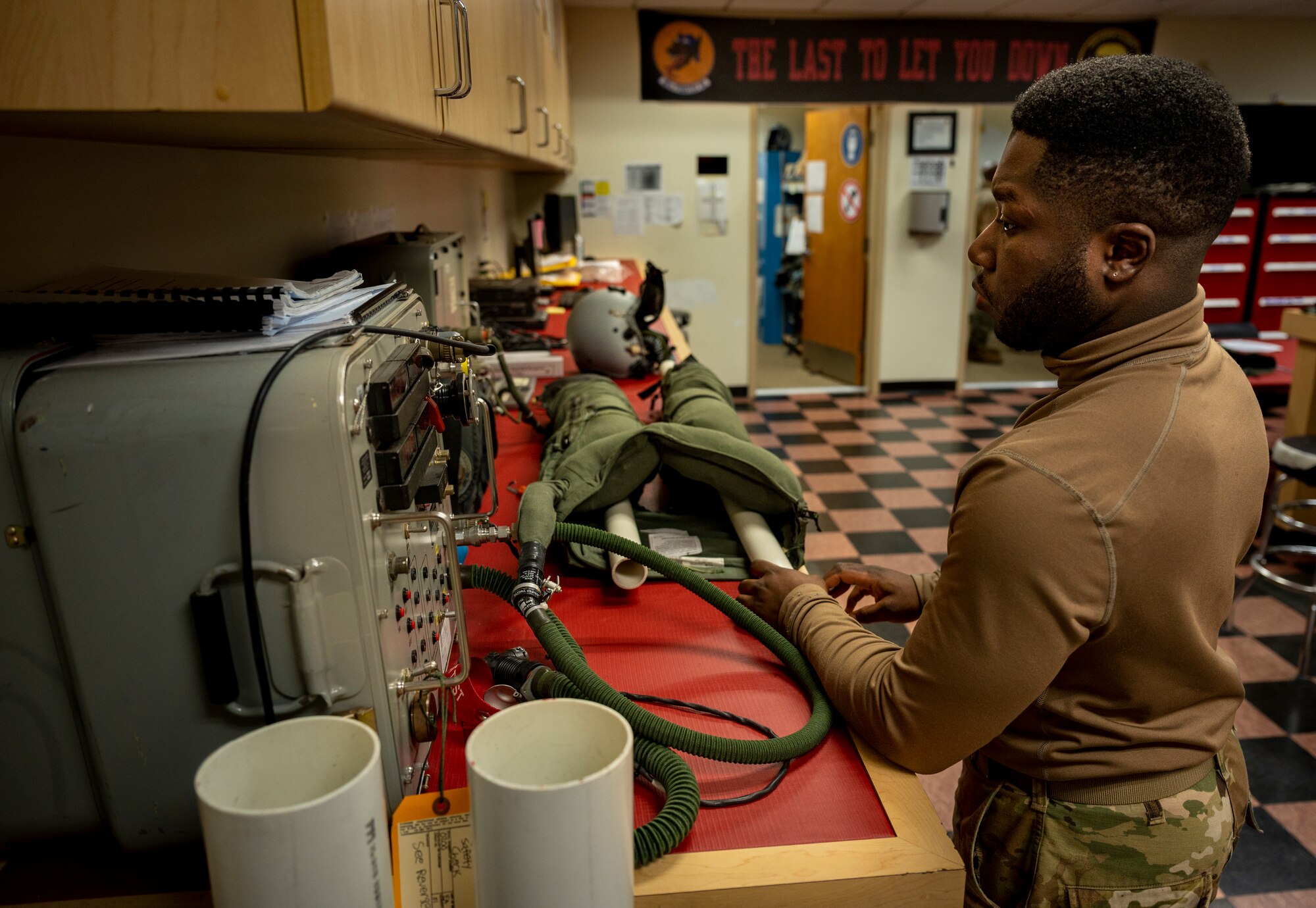 U.S. Air Force Senior Airman Dorien Hamilton, 51st Operations Support Squadron aircrew flight equipment journeyman, performs integrity tests on a G-suit at Osan Air Base, Republic of Korea, Dec. 8, 2022.