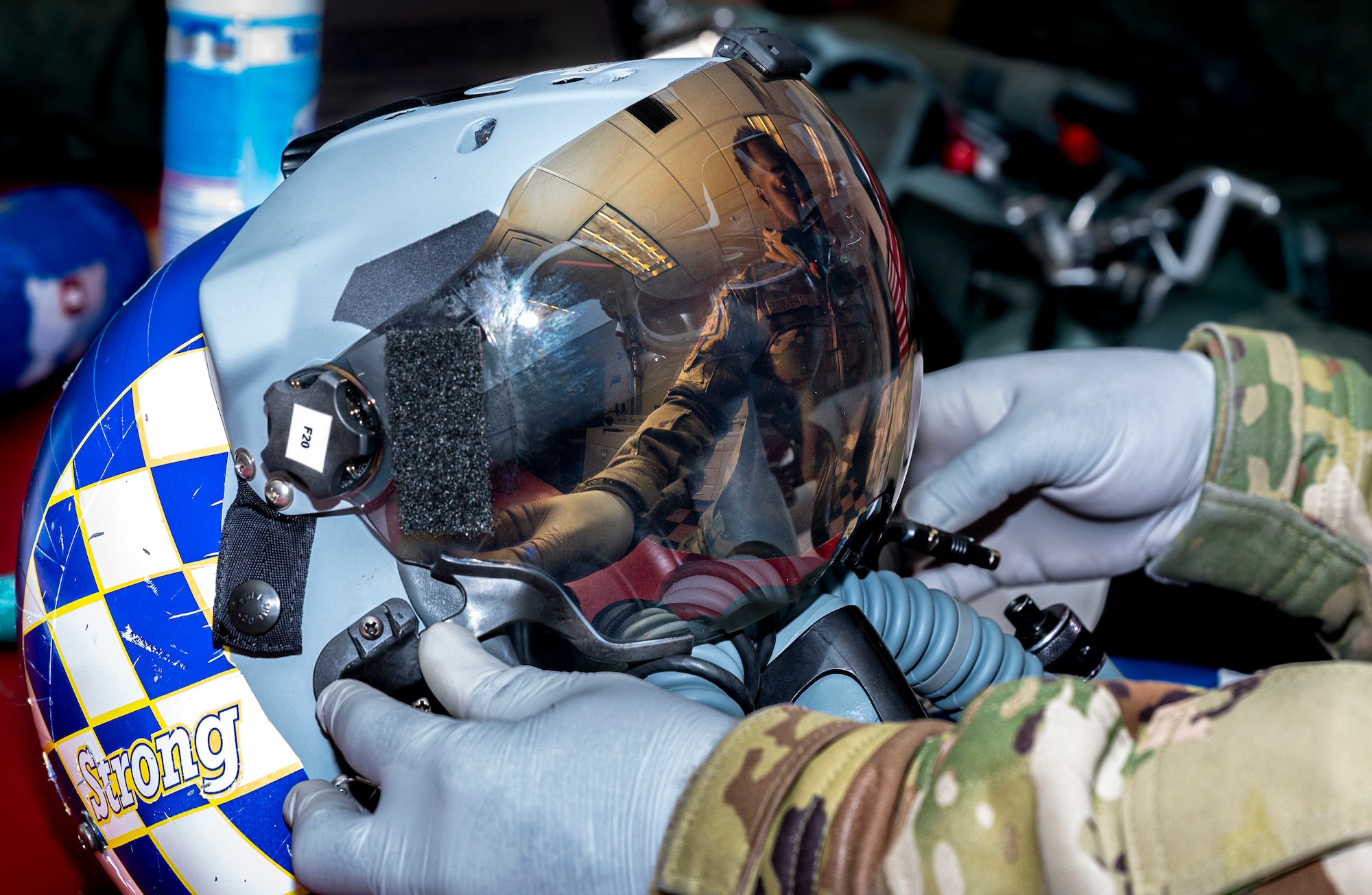 U.S. Air Force Senior Airman Joseph Asante, 51st Operations Support Squadron aircrew flight equipment (AFE) journeyman, performs routine maintenance on an HGU-55 helmet at Osan Air Base, Republic of Korea, Dec. 8, 2022.