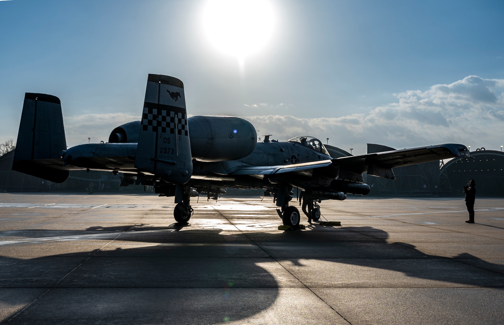 A U.S Air Force Airmen assigned to the 25th Fighter Generation Squadron signals an A-10C Thunderbolt II on the flightline at Osan Air Base, Republic of Korea, Dec. 7, 2022.
