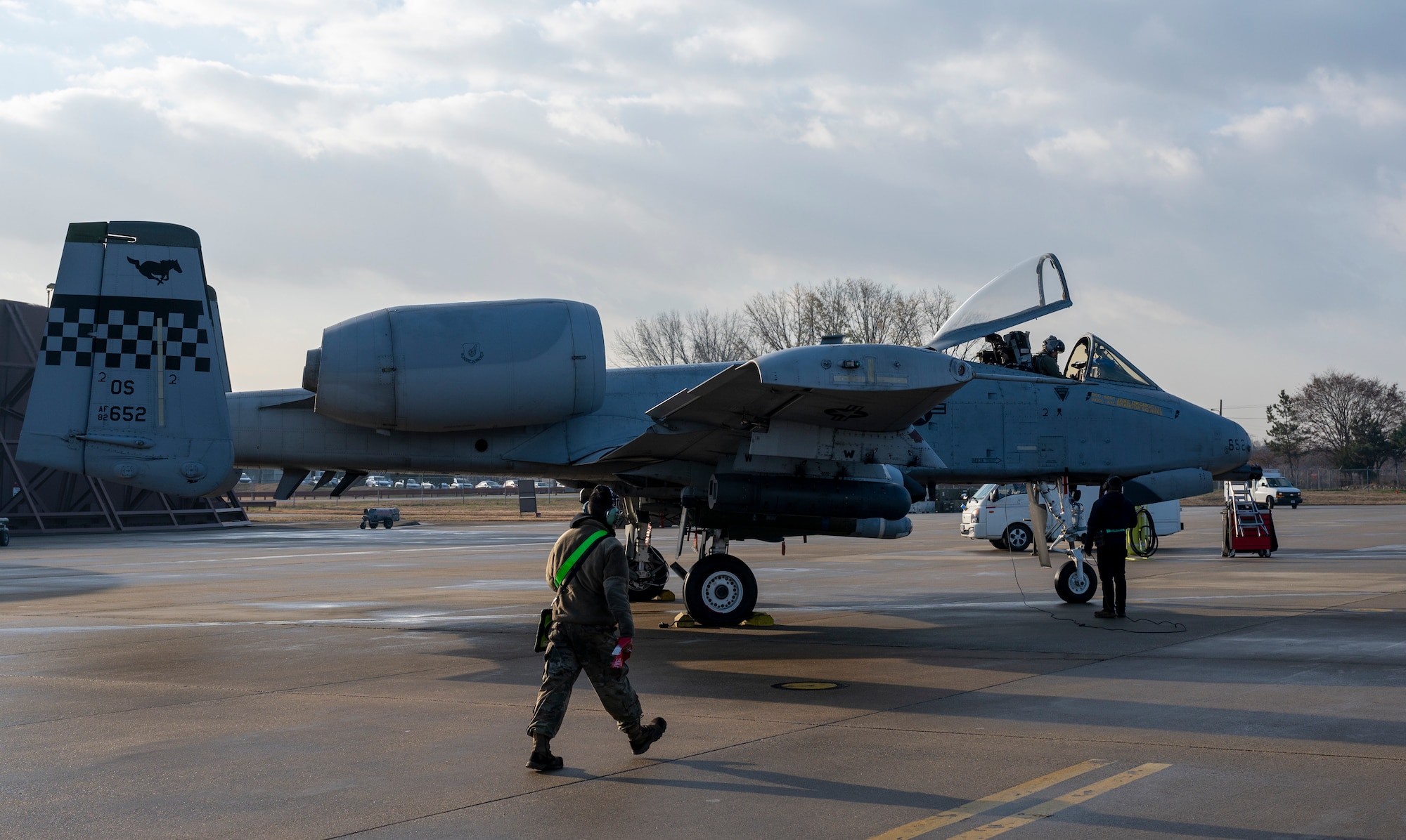 Airmen assigned to the 25th Fighter Generation Squadron perform preflight checks on an A-10C Thunderbolt II at Osan Air Base, Republic of Korea, Dec. 7, 2022.