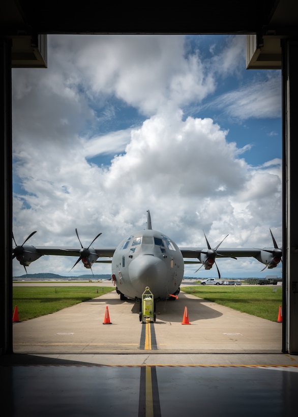 A C-130J Super Hercules aircraft provides the backdrop for a ceremony at the Kentucky Air National Guard Base in Louisville, Ky., Sept. 11, 2022, in which Col. Michael A. Cooper retired as commander of the 123rd Medical Group. Cooper served for 30 years in the Kentucky Army National Guard, Air Force Reserve and Kentucky Air National Guard. (U.S. Air National Guard photo by Dale Greer)