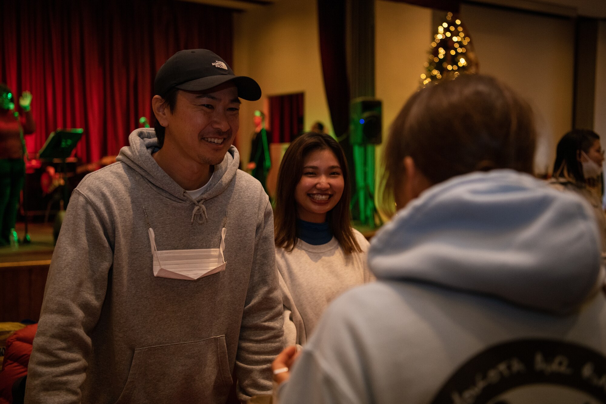 Vendors smiling at patrons.