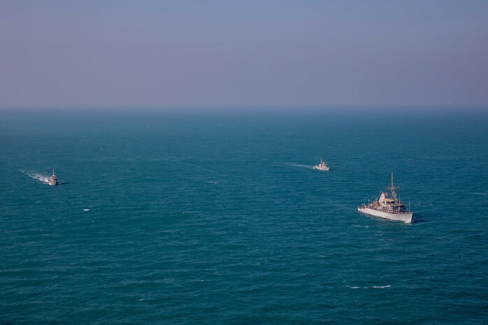 221211-A-NR779-1045 ARABIAN GULF (Dec. 11, 2022) U.S. Navy mine countermeasures ship USS Dextrous (MCM 13), right, operates in the Arabian Gulf with ships from the Iraq Navy and Kuwait Coast Guard, Dec. 11. Iraq, Kuwait and the United States completed a joint patrol in the Arabian Gulf for the second time in four months to promote regional maritime security.