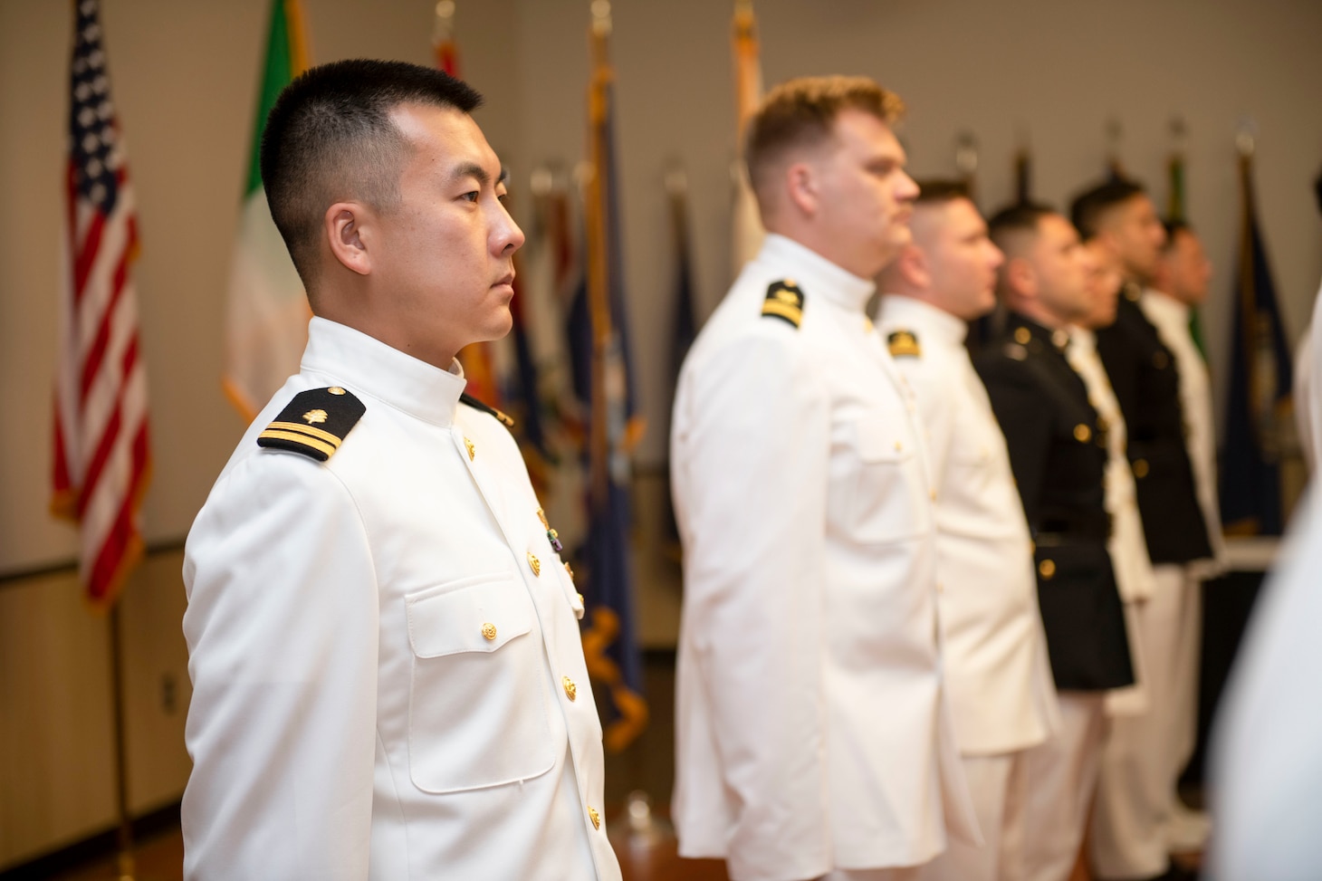 CORPUS CHRISTI, Texas - Lt. Danny Xu stands with his fellow naval aviators to recite the Flyer's Creed after receiving his Wings of Gold, Aug. 5. Xu is the first Aeromedical Dual Designator (AMDD) to transition from flight surgeon to pilot in 20 years.