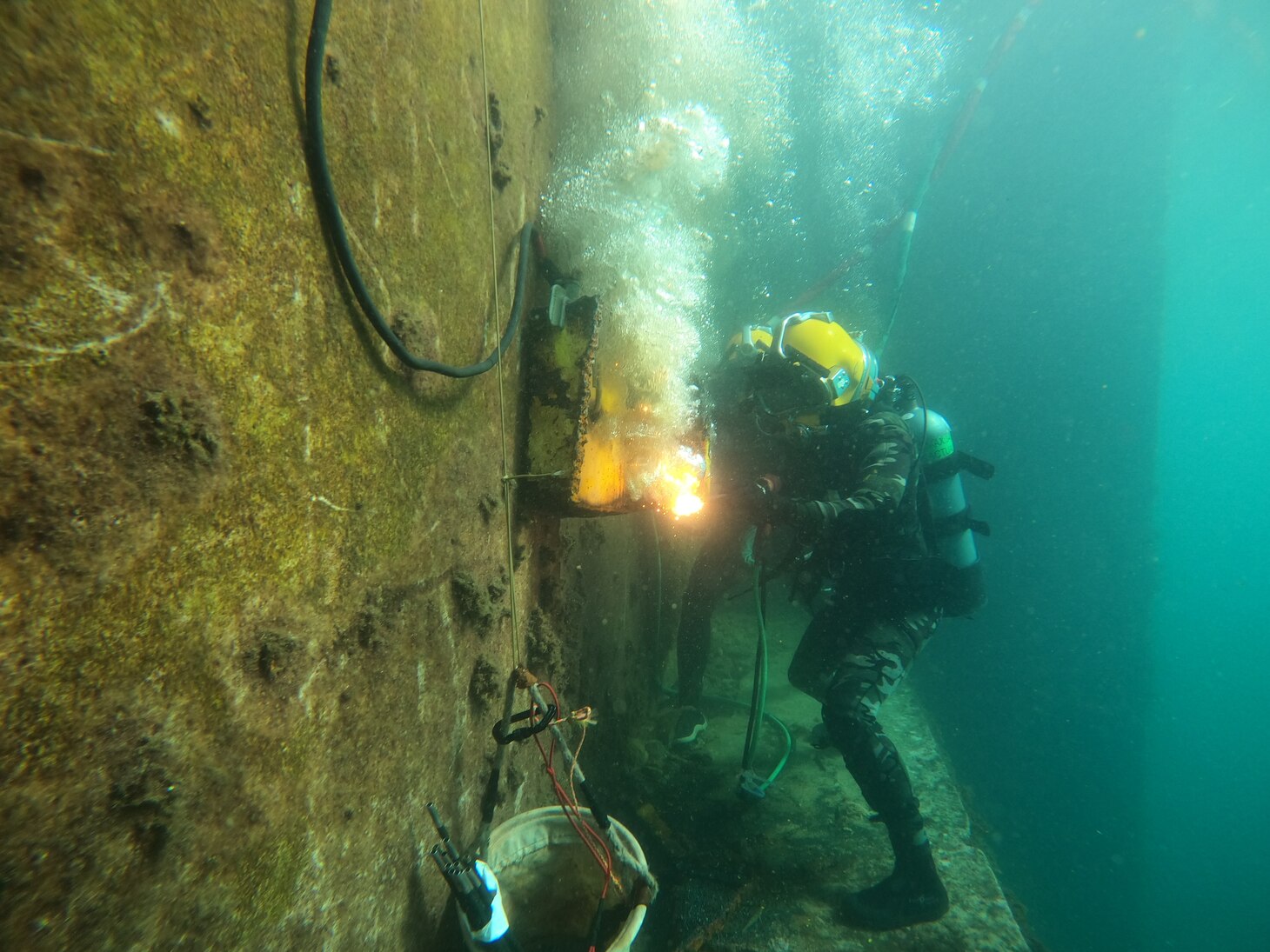 U.S. Navy divers from the Royal Moroccan Navy and the U.S. Navy’s Underwater Construction Team 1 conduct underwater exothermic cutting operations at the Royal Moroccan Navy Dive School in Ksar Sghir, Morocco, Nov. 23, 2022.