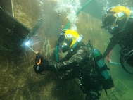 Navy divers from the Royal Moroccan Navy and the U.S. Navy’s Underwater Construction Team 1 conduct underwater welding operations at the Royal Moroccan Navy Dive School in Ksar Sghir, Morocco, Nov. 23, 2022.