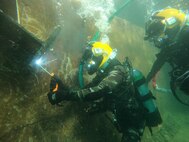 Navy divers from the Royal Moroccan Navy and the U.S. Navy’s Underwater Construction Team 1 conduct underwater welding operations at the Royal Moroccan Navy Dive School in Ksar Sghir, Morocco, Nov. 23, 2022.