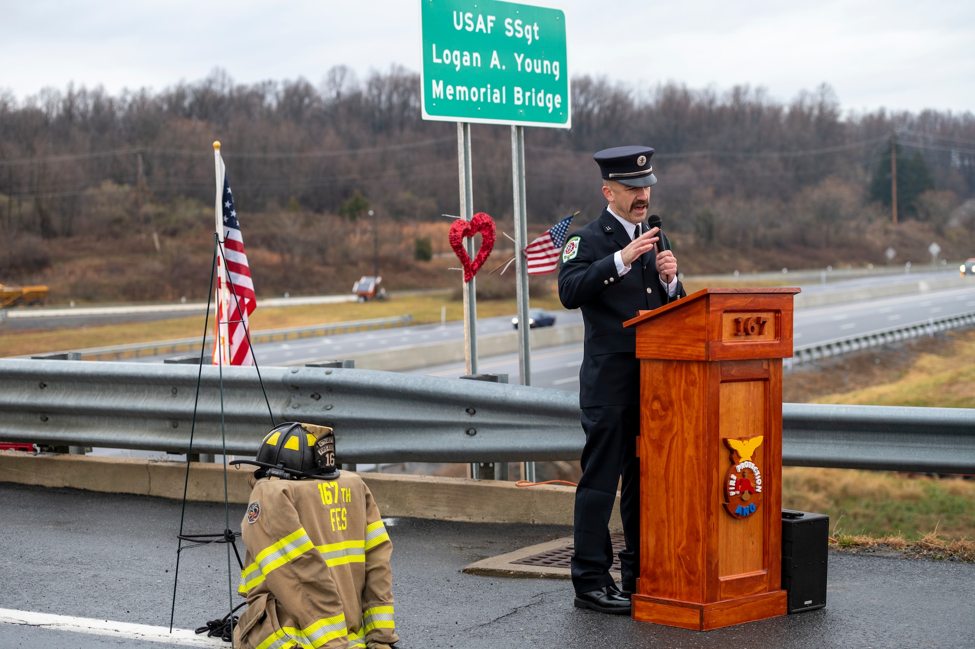 Firefighter Captain Bradley Wright, South Berkeley County Station 20, speaks at the bridge dedication ceremony for the U.S. Air Force Staff Sgt. Logan A. Young Memorial Bridge, Dec. 3, 2022. Wright drafted the resolution the led to the bridge renaming.