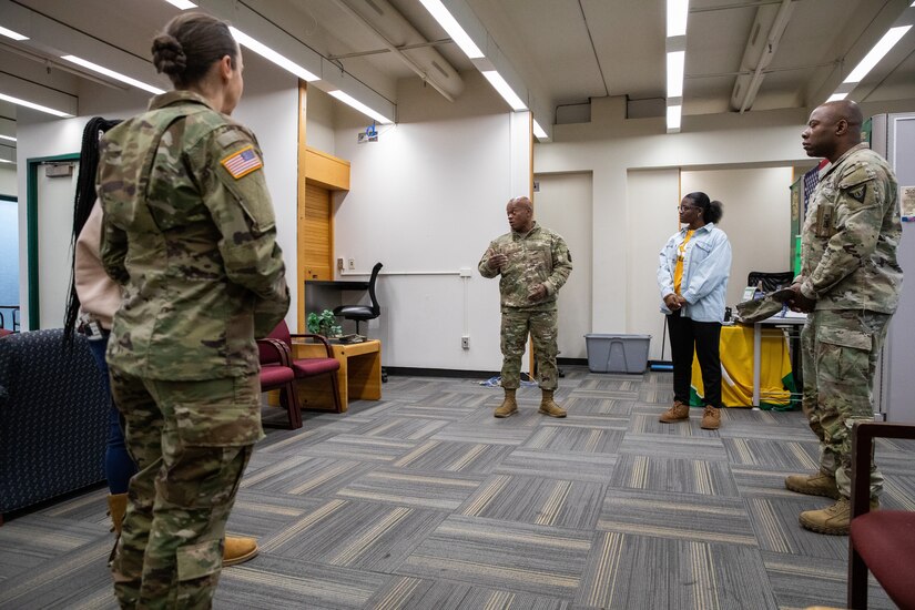 Senior Enlisted Advisor Tony Whitehead (left) shakes hands with cadets of the Kentucky State University's Reserve Officer Training Corps at the college's campus in Frankfort, Ky. on Dec. 6, 2022. Whitehead is visiting historically black colleges and universities to talk to cadets about their ROTC programs. (U.S. Army photo by Staff Sgt. Andrew Dickson)