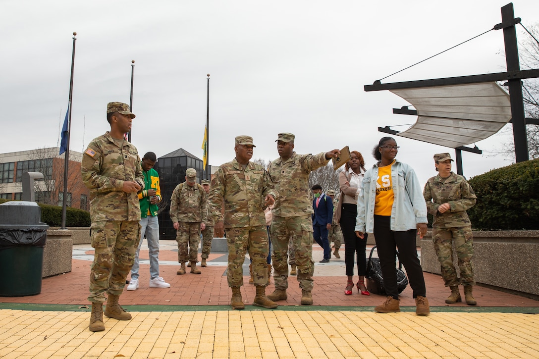 Senior Enlisted Advisor Tony Whitehead (left) shakes hands with cadets of the Kentucky State University's Reserve Officer Training Corps at the college's campus in Frankfort, Ky. on Dec. 6, 2022. Whitehead is visiting historically black colleges and universities to talk to cadets about their ROTC programs. (U.S. Army photo by Staff Sgt. Andrew Dickson)