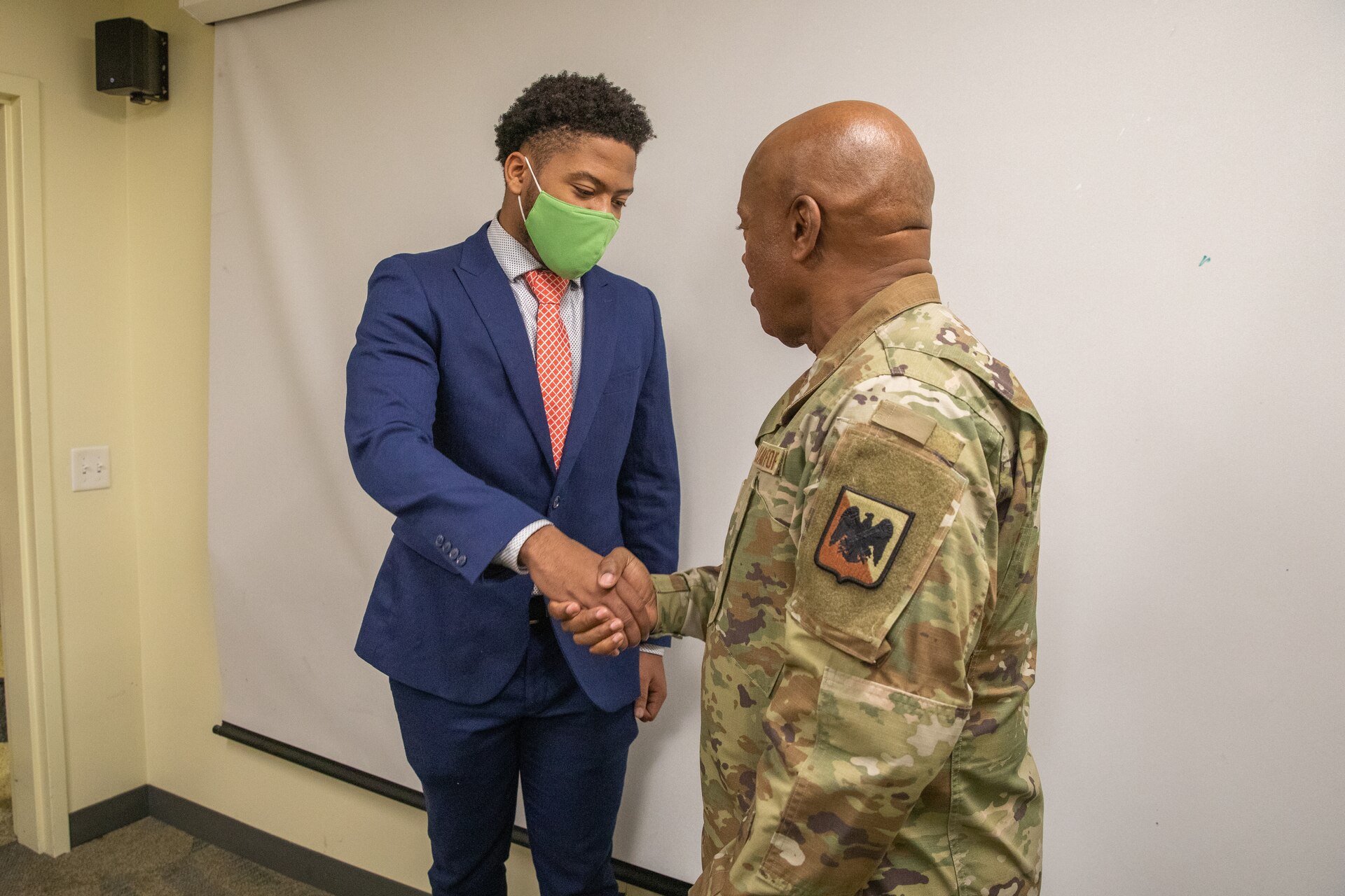 Senior Enlisted Advisor Tony Whitehead (left) shakes hands with cadets of the Kentucky State University's Reserve Officer Training Corps at the college's campus in Frankfort, Ky. on Dec. 6, 2022. Whitehead is visiting historically black colleges and universities to talk to cadets about their ROTC programs. (U.S. Army photo by Staff Sgt. Andrew Dickson)