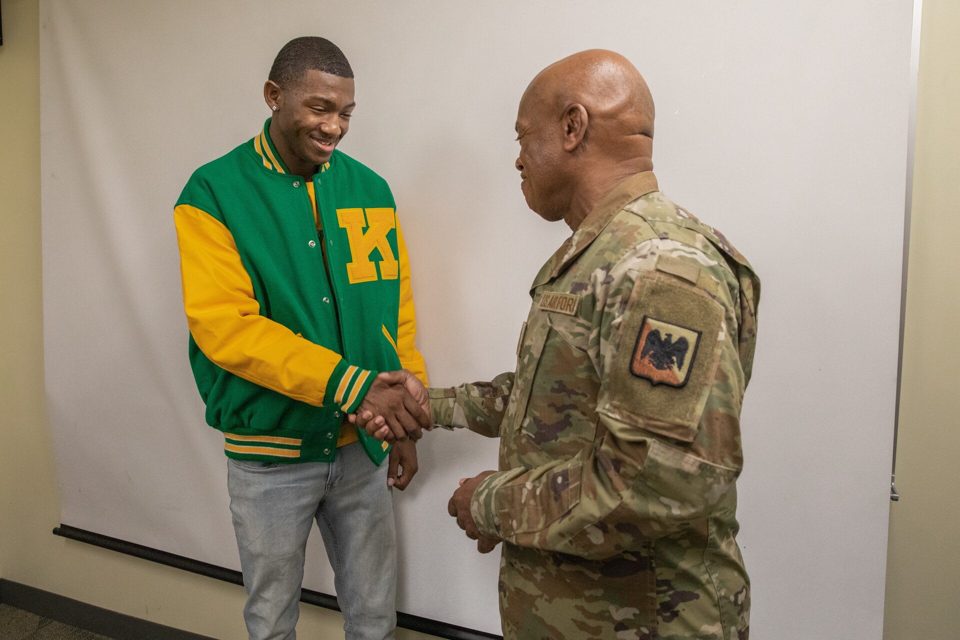 Senior Enlisted Advisor Tony Whitehead (left) shakes hands with cadets of the Kentucky State University's Reserve Officer Training Corps at the college's campus in Frankfort, Ky. on Dec. 6, 2022. Whitehead is visiting historically black colleges and universities to talk to cadets about their ROTC programs. (U.S. Army photo by Staff Sgt. Andrew Dickson)